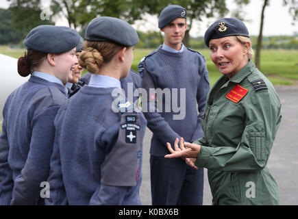 Carol Vorderman, an honorary group captain and ambassador for the RAF Air Cadets, visiting young air cadets before she receives the Lennox-Boyd Trophy, an aviation award, whilst at RAF Syerston, Nottinghamshire. Stock Photo