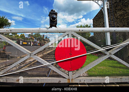 Level Crossing at Oakworth Station on the Keighley & Worth Valley Railway line in West Yorkshire. Stock Photo