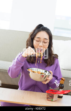 Portrait of young NEET woman eating bibimbap Stock Photo