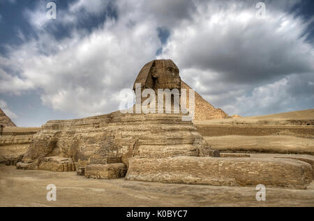 The Sphinx guarding the pyramids on the Giza plateu in Cairo, egypt.