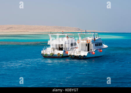 two yachts anchored outside Giftin Island in the Red Sea, a popular tourist destintion Stock Photo