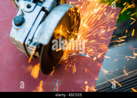 metal sawing with grinder close up Stock Photo