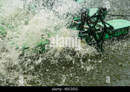 Water turbine is working, water splash around the turbine which hitting the water Stock Photo