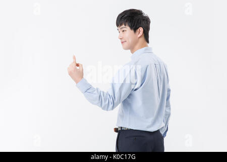 Side view of young smiling man holding a hand Stock Photo
