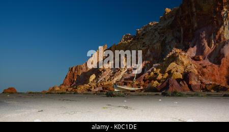 Fishing Boat at Low tide Ponta Grossa Beach, Icapui, Ceara, Brazil Stock Photo