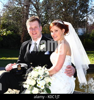 Wedding photographs including a groom in a wheelchair and grooms in military uniform. Stock Photo