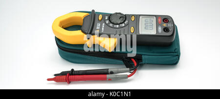 Digital clamp meter with probes on white background with copy space Stock Photo