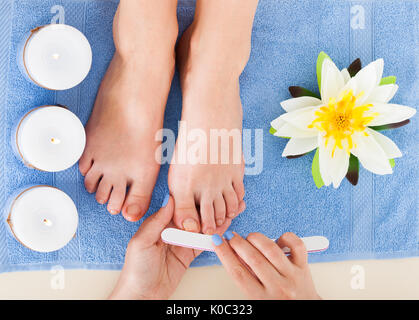 Cropped image of woman undergoing pedicure process in beauty salon Stock Photo