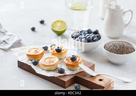 homemade mini cheesecakes with blueberries for breakfast. Stock Photo