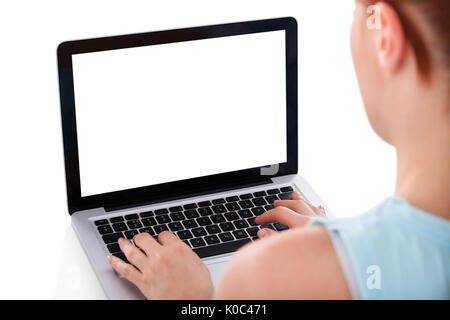 Cropped image of young woman using laptop over white background Stock Photo