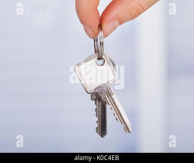 Closeup photo of woman's hand holding keys Stock Photo