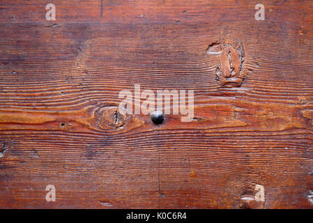 Detail of old wooden door with rusted iron nails Stock Photo