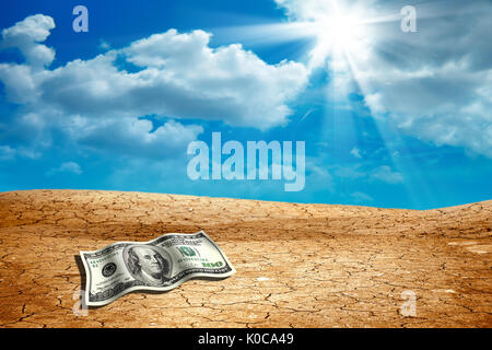 conceptual image of money on dried and cracked landscape Stock Photo