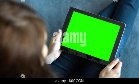 Girl Holding Tablet PC on Blue Stock Photo