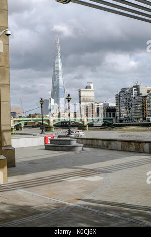 London, United Kingdom - August 3, 2017: View accross the River Thames looking towards the Shard.  Taken from under the Millennium Bridge with no body Stock Photo