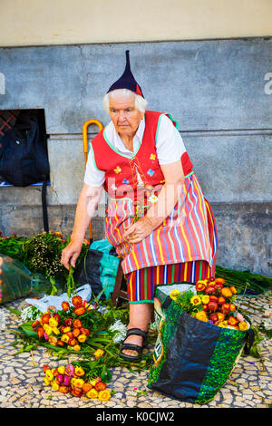 Woman selling flowers. Stock Photo
