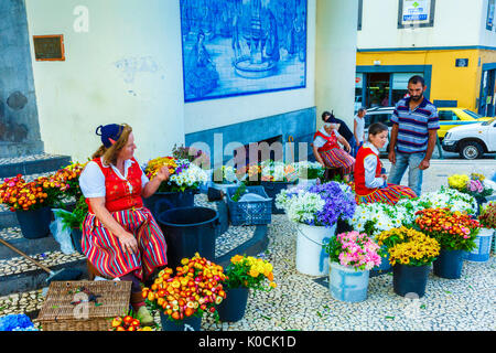 Woman selling flowers. Stock Photo