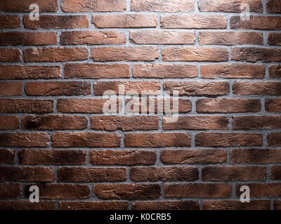 Dark brown brick wall. Close-up picture of bricks. Stock Photo