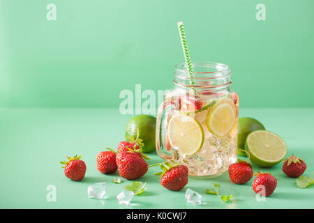 refreshing summer lemonade with strawberry and lime in mason jar Stock Photo