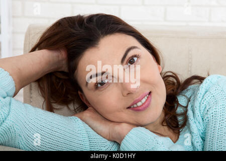 Woman look.. Beauty woman with white perfect smile looking at camera at home Stock Photo