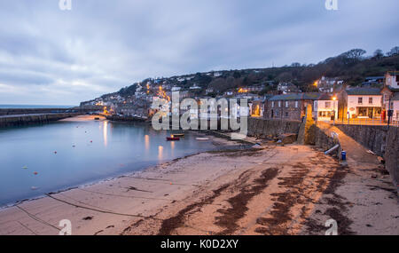 Mousehole Harbour in Cornwall at sunrise. Stock Photo