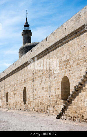 Walls and tower of Aigues-Mortes castle against blue sky, France Stock Photo