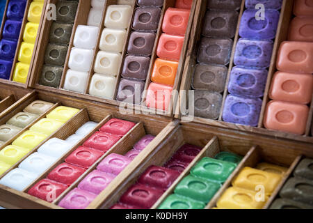 Rows of colorful French Marseille hard soaps arranged in boxes Stock Photo