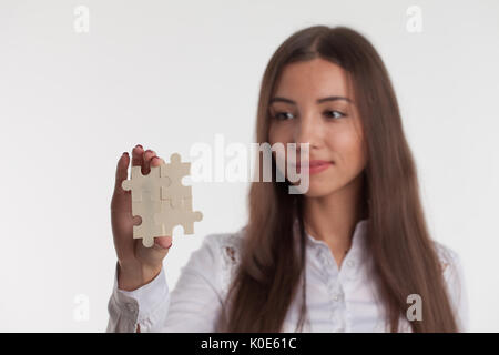 Problem solution concept flat.Man's hand places last detail of puzzle in jigsaw. Stock Photo