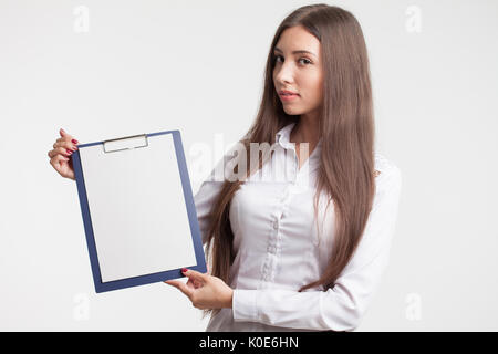 Beautiful woman wearing formal wear. Secretary with clipboard. Stock Photo