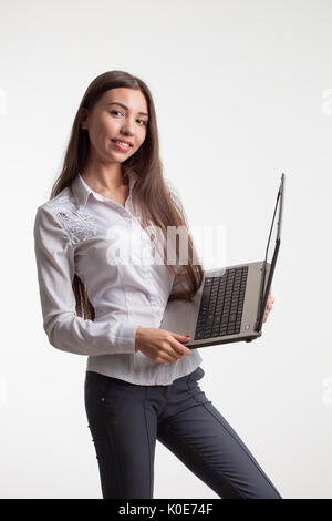 young businesswoman using laptop, isolated on white background. Stock Photo