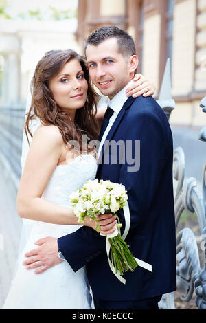 Wedding day. Portrait of happy married couple blonde bride and groom ...