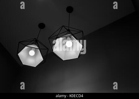 Two pendant lamps hanging on ceiling. Contemporary Design in black and white shade. Stock Photo