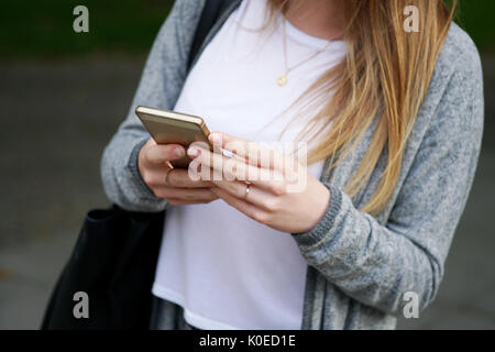 young woman using smartphone Stock Photo