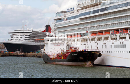 Southampton Docks England UK. August 2017. Bunkering vessel alongside a cruise ship pumping fuel Stock Photo