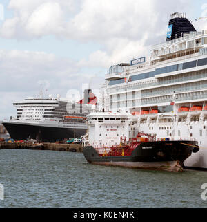 Southampton Docks England UK. August 2017. Bunkering vessel alongside a cruise ship pumping fuel Stock Photo