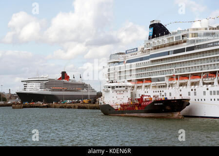 Southampton Docks England UK. August 2017. Bunkering vessel alongside a cruise ship pumping fuel Stock Photo