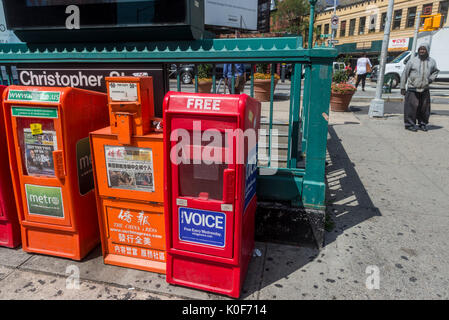 New York, NY, USA. 23rd Aug, 2017. An empty Village Voice newspaper box sadly waits in Sheridan Square to be refilled. On Tuesday, August 22, Peter D Barbey announced the 62 year old alternative weekly newspaper would cease publication of its print edition. An online edition will still be available via the internet CREDIT: Credit: Stacy Walsh Rosenstock/Alamy Live News Stock Photo