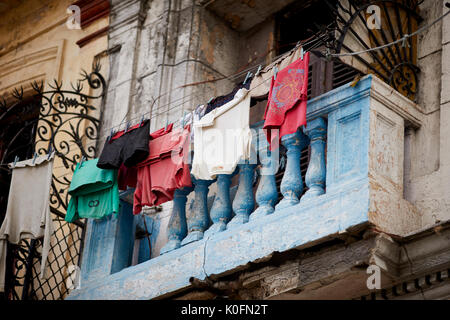 Cuban, cuba, Capital, Havana typical street scene balconies and apartments with washing hanging on a line to dry in the sun Stock Photo