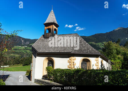 Landscape protection area Achstürze. Blasius chapel in Oetz-Piburg, alps in background. Tirol oldest nature preserves. Oetz alps, unique cultural moun Stock Photo