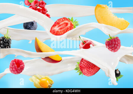 milk splash with fruits and berries on blue background. Stock Photo