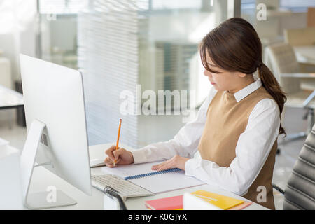 Side view portrait of young female fashion designer Stock Photo