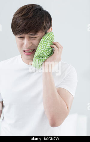 Portrait of man having toothache Stock Photo