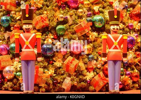 Nutcracker Christmas holiday decorations with glass bulbs, presents, ornaments and tinsel on Christmas tree at Winter WonderFest at Chicago Navy Pier. Stock Photo