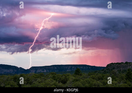 Sunset lightning and monsoon thunderstorm clouds over Sedona, Arizona Stock Photo