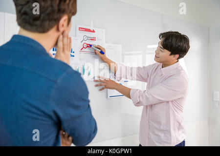 Two smiling businessmen having a meeting Stock Photo