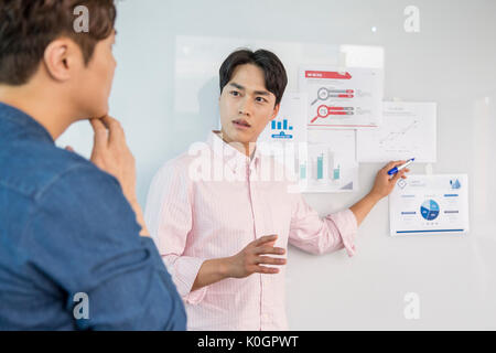 Two businessmen having a discussion about data Stock Photo