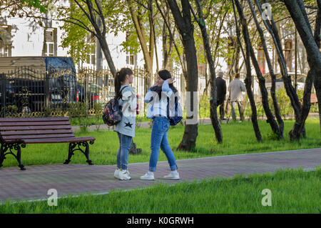Girls chatting in in the Warriors-Winners Park in Lefortovo neighborhood. Stock Photo