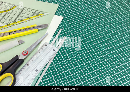Green Cutting Mat and Metal Ruler Stock Photo - Image of material