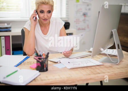 Executive checking some important information Stock Photo