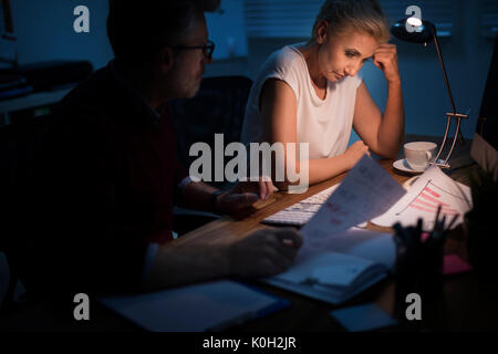 Very tired workers during work at the project Stock Photo
